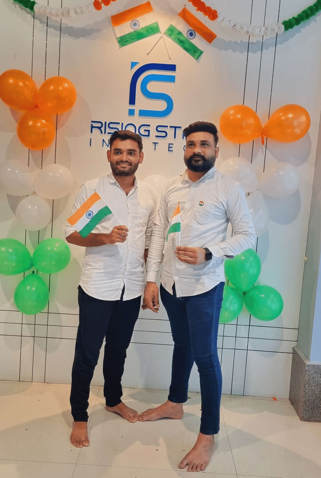 two men standing in front of balloons